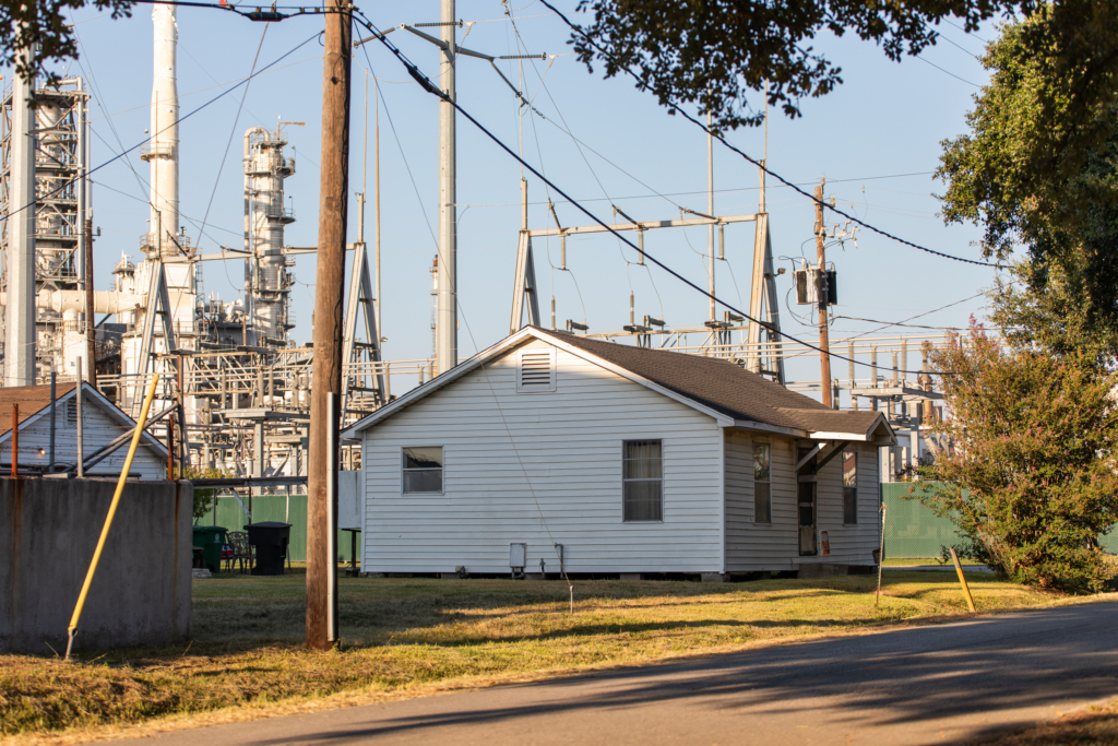 A house on the fenceline of a petrochemical plant in the Houston Ship Channel area
