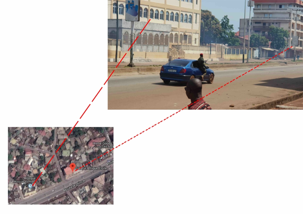 Photo datant du 15 octobre 2018 authentifiée par le Service de vérification numérique d'Amnesty International qui a été en mesure de localiser deux bâtiments iidentiques à ceux sur la photo. La photo a été prise à Route Le Prince, à côté de la mosquée de Koloma.