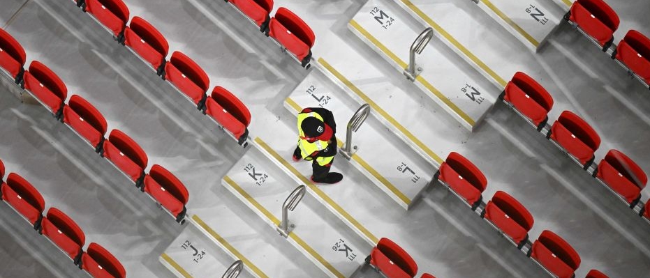 A security guard in an empty stand at the FIFA World Cup in Qatar in 2022